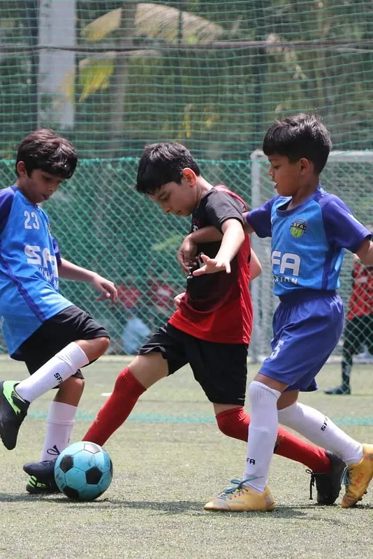 Young footballers competing in a match