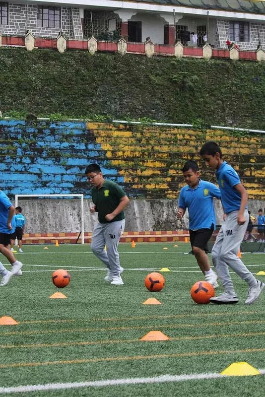 Young players taking part in coached football drills